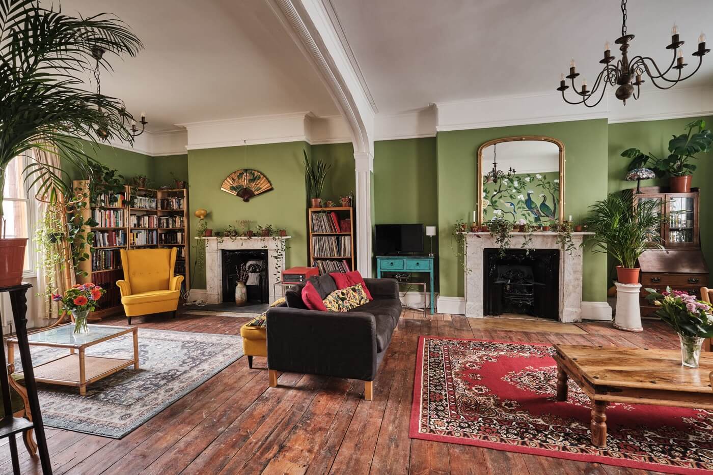 A Colorful Eclectic Home in England 1 large-green-sitting-room-rugs-eclectic-decor-plants-nordroom
