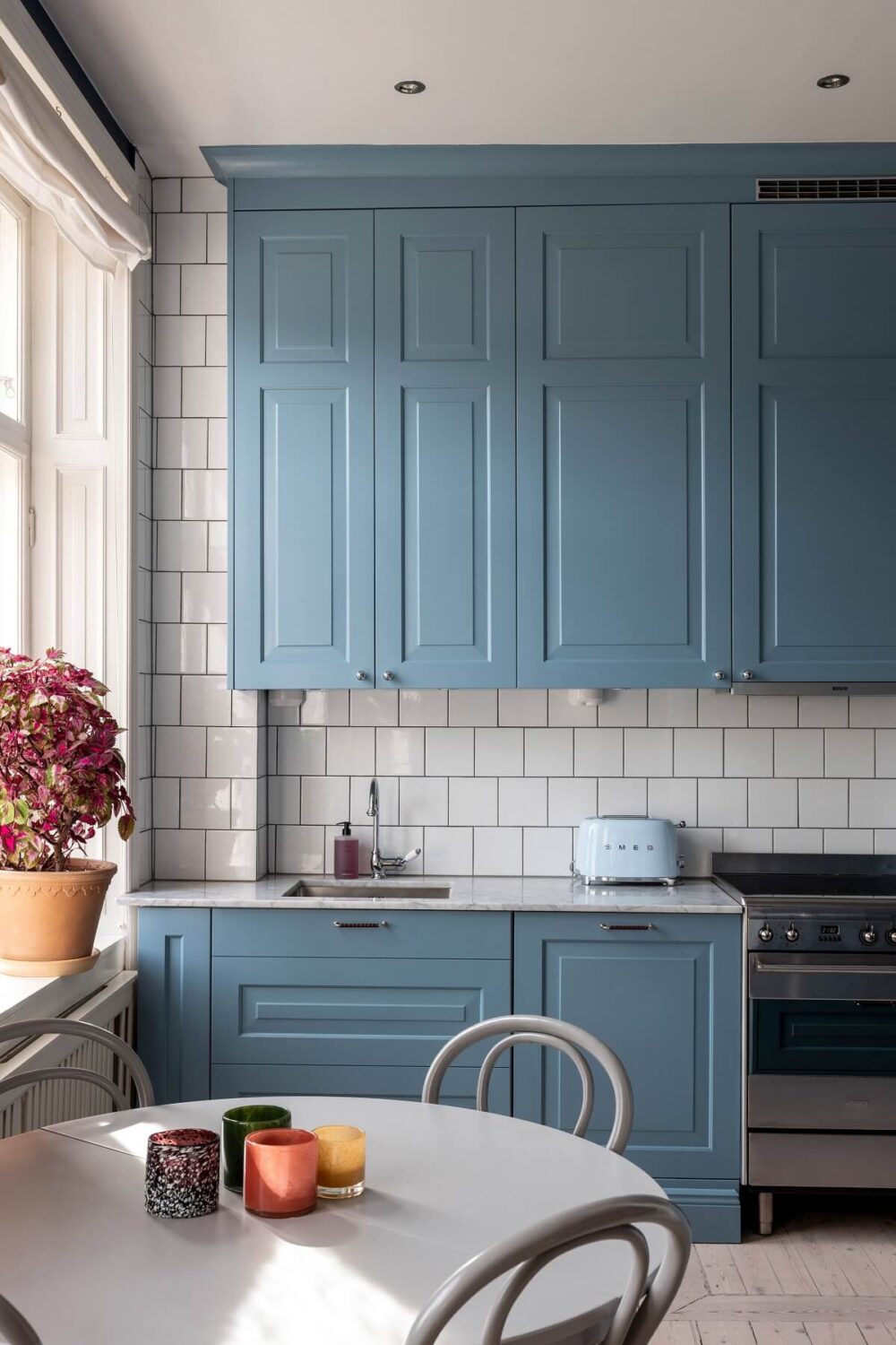 A Nordic Home with Blue Sitting Room and Kitchen 10 light-blue-kitchen-cabinets-nordroom