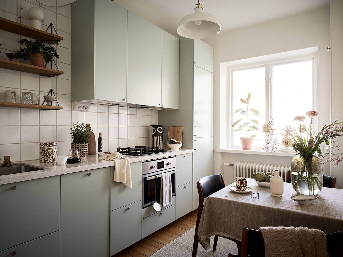 A Pink Studio Apartment with Green Bathroom 9 light-gray-kitchen-cabinets-scandinavian-studio-apartment-nordroom