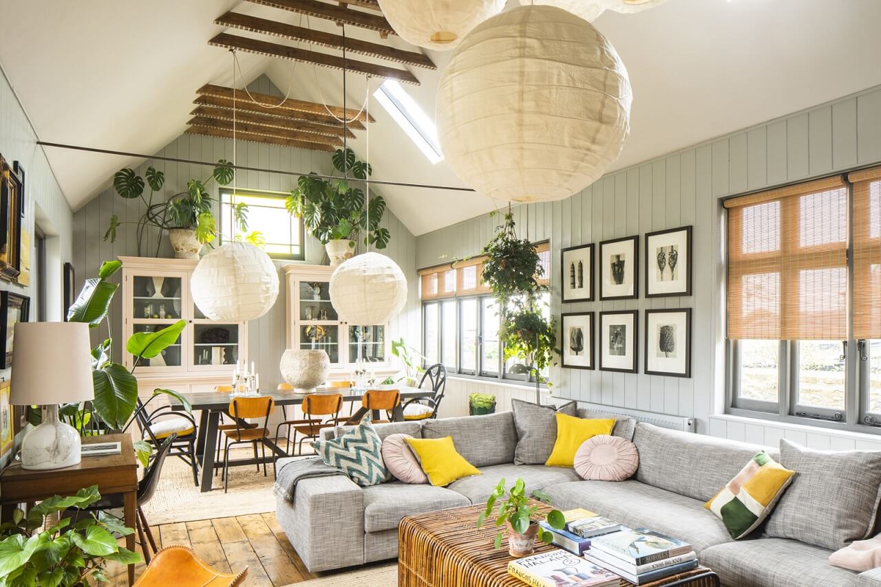 A Cozy Victorian Country House in England 1 living-room-slanted-ceiling-exposed-beams-plants-corner-sofa-nordroom
