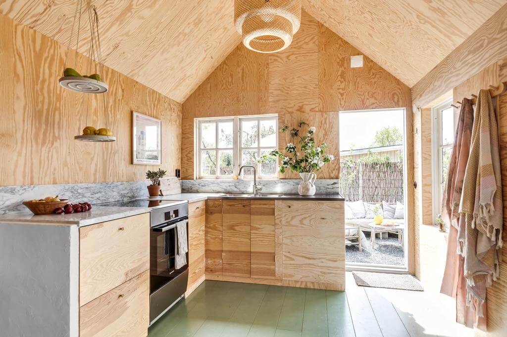 A Colored Sixth Wall May Be The Biggest Paint Trend in 2026 10 modern wooden kitchen green painted floorboards nordroom A Colored Sixth Wall May Be The Biggest Paint Trend in 2026