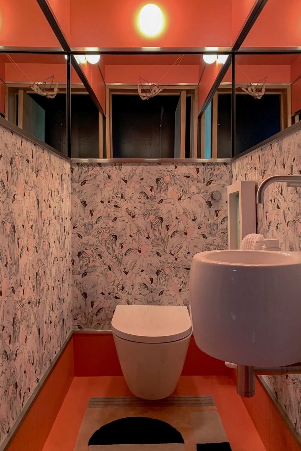 A Spectacular Modern Black Loft in London 11 orange-toilet-birds-wallpaper-loft-nordroom