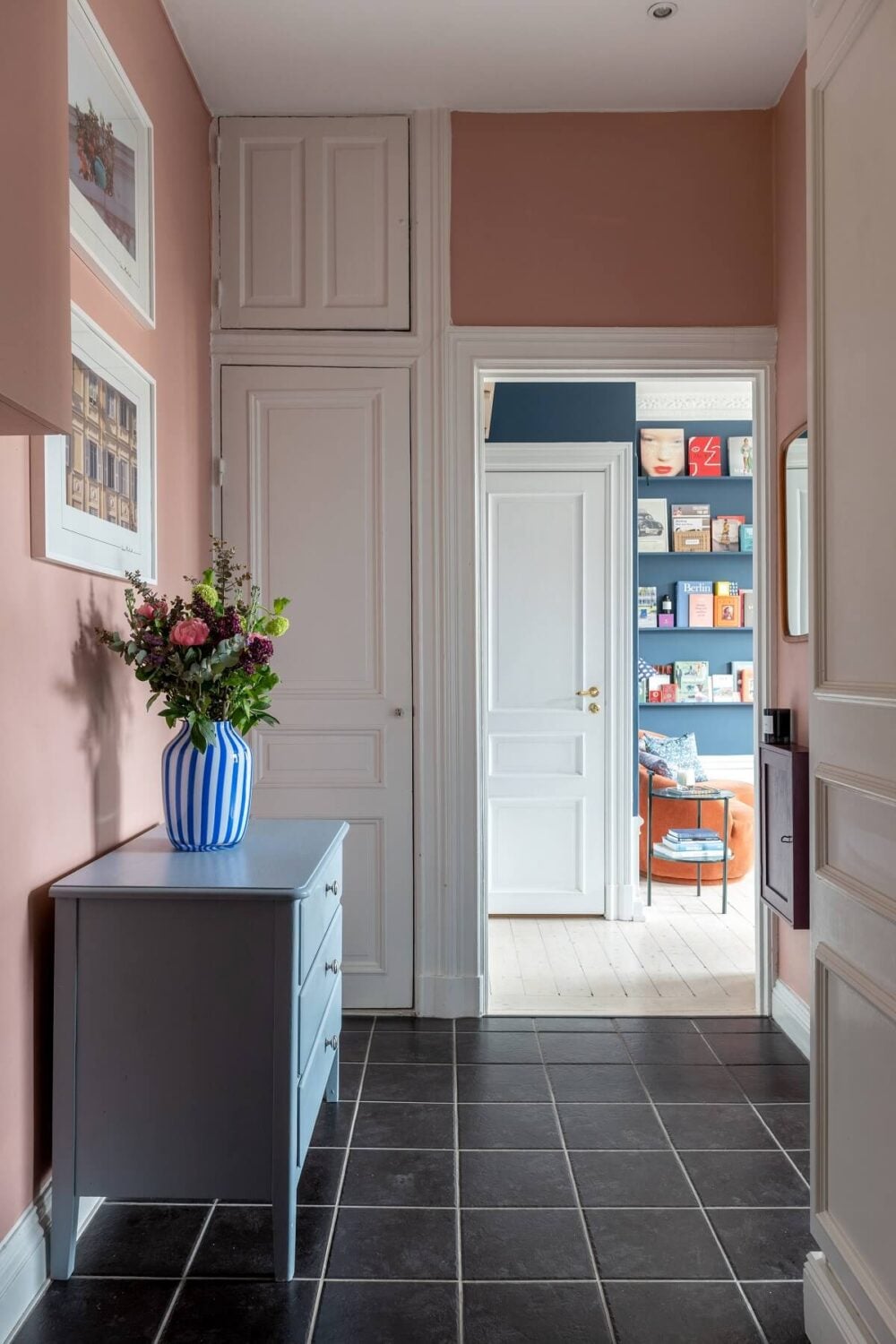 A Nordic Home with Blue Sitting Room and Kitchen 26 pink-hallway-blue-cabinet-nordroom