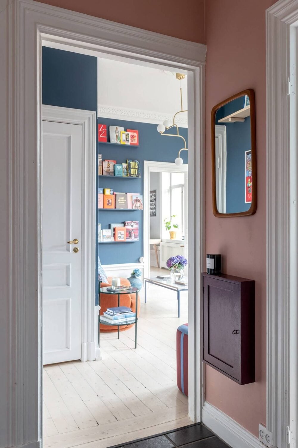 A Nordic Home with Blue Sitting Room and Kitchen 24 pink-hallway-narrow-wall-cabinet-nordroom