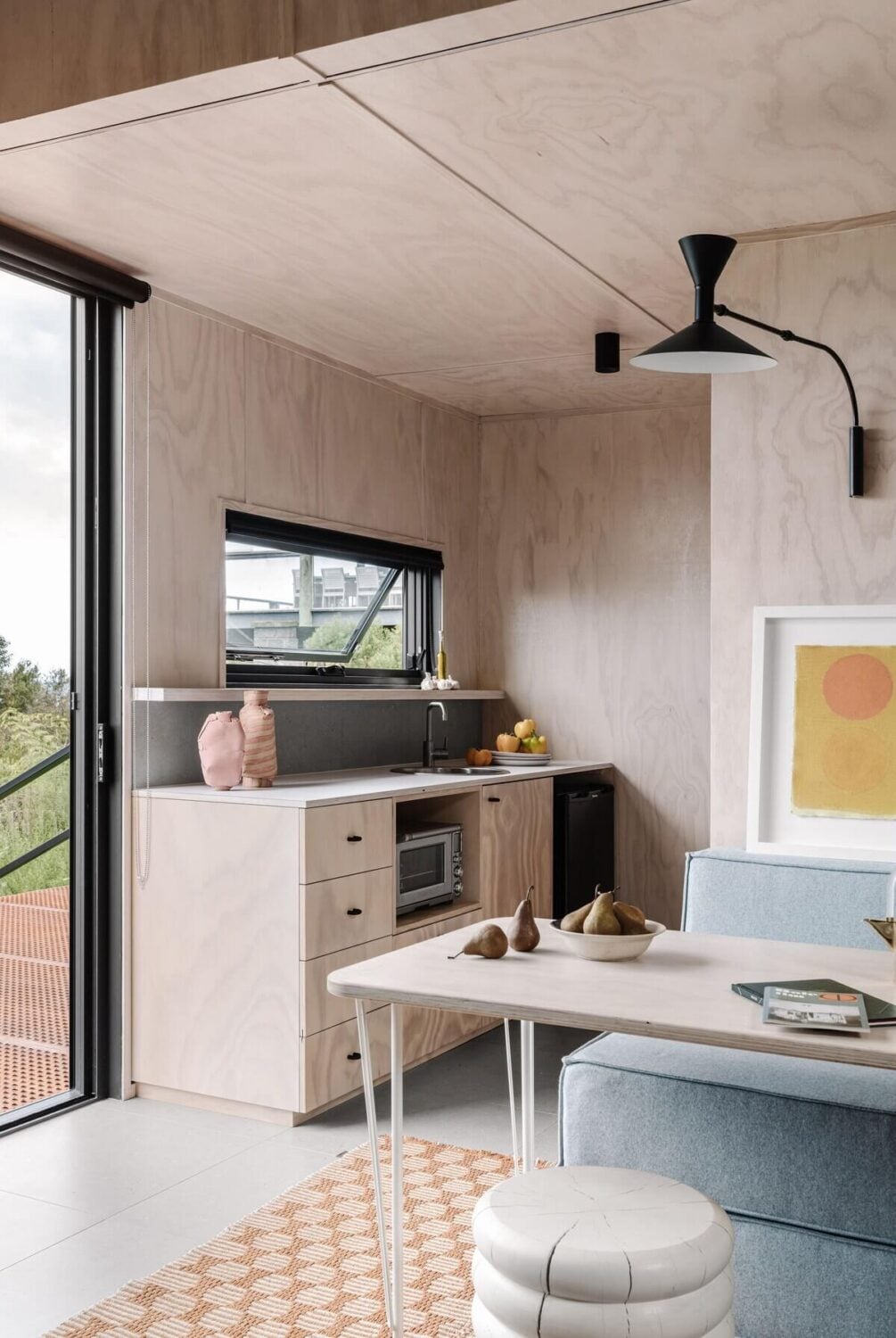 A Small Modern Seaside Retreat in Australia 4 plywood-kitchen-sofa-bed-airbnb-australia-nordroom