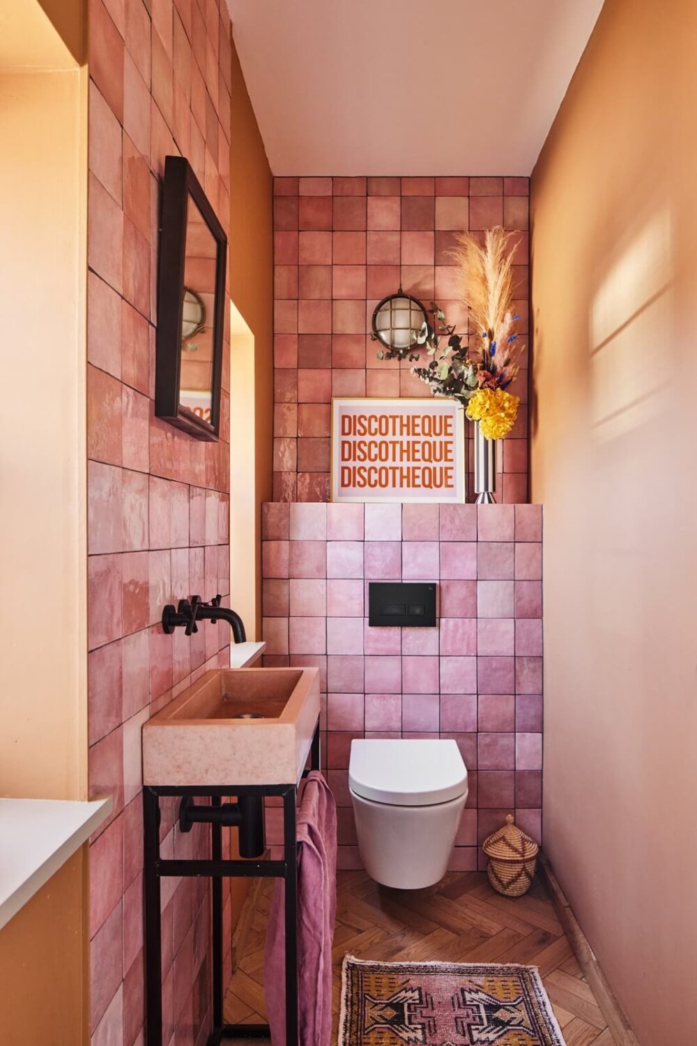 89 Pink Bathroom Ideas: From Hot Pink Walls to Blush Tiles 13 powder-oom-toilet-pink-tiles-nordroom