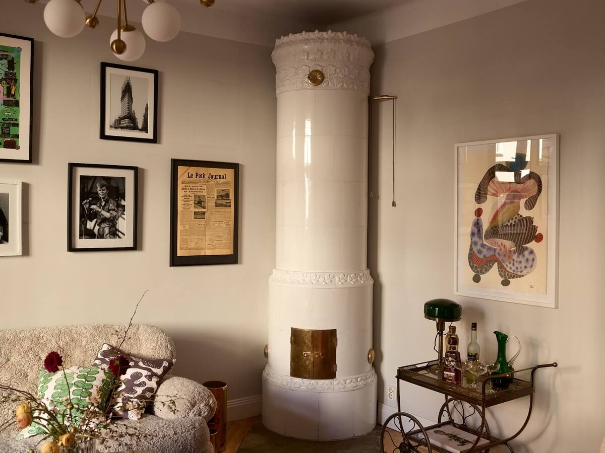 A Bedroom with Yellow French Wallpaper in a Small Scandi Home 4 round-tiled-fireplace-nordic-apartment