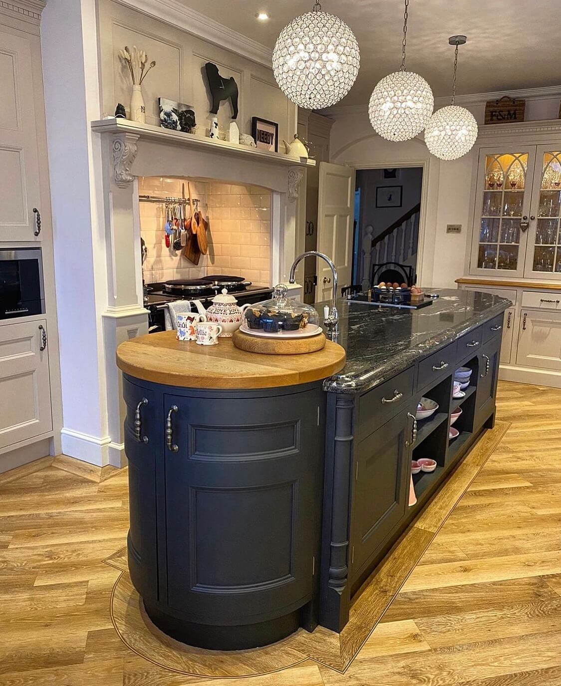 A Wonderful Eclectic Maximalist Home in England 10 rounded-black-kitchen-island-edwardian-home-nordroom