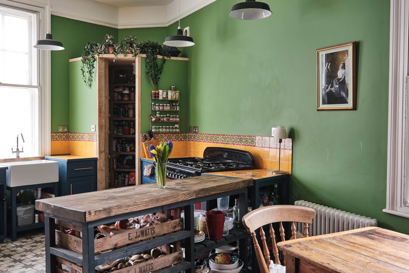 A Colorful Eclectic Home in England 15 rustic-kitchen-green-walls-yellow-tiles-blue-cabinets-nordroom
