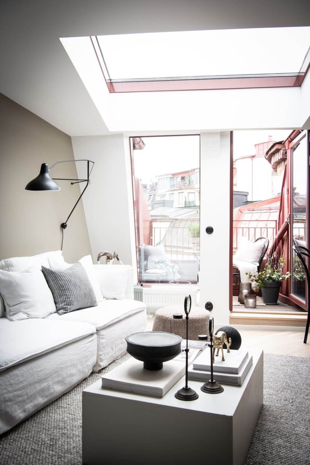 A Light Nordic Attic Loft with Raw Walls and Skylights 3 scandinavian-attic-apartment-skylight-nordroom