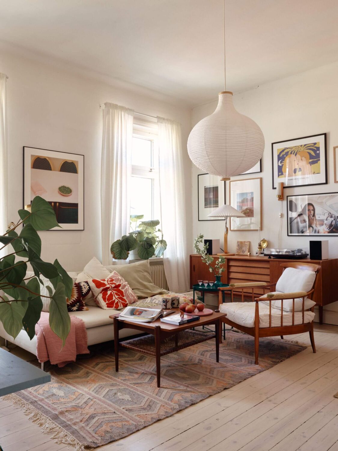 A Charming Apartment with Muted Blue Bedroom 1 scandinavian-sitting-room-midcentury-gallery-wall-wooden-floor-nordroom