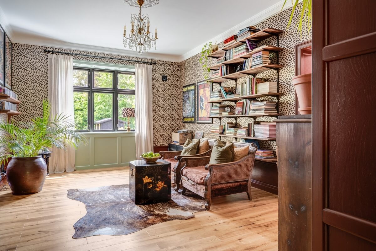 A Colorful Family Home in a Former School Building 6 sitting-room-antique-armchairs-bookshelves-wallpaper-nordroom