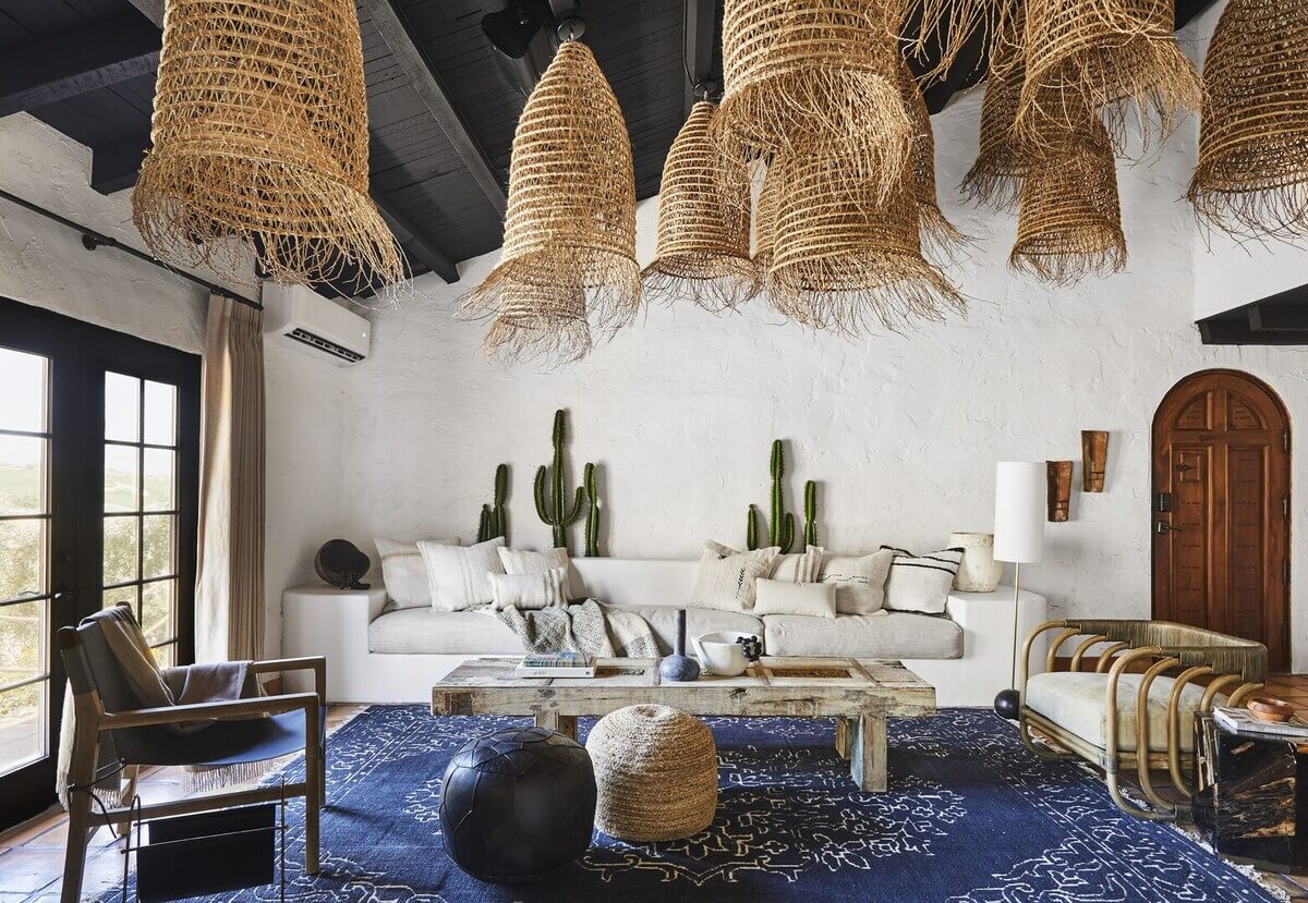 Queer Eye's Bobby Berk Designed An Airbnb Villa in California 2 sitting-room-black-painted-wooden-floor-blue-rug-nordroom