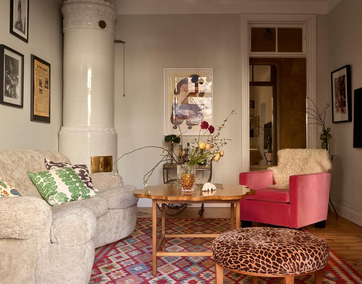 A Bedroom with Yellow French Wallpaper in a Small Scandi Home 3 sitting-room-colorful-rug-pink-velvet-armchair-nordroom