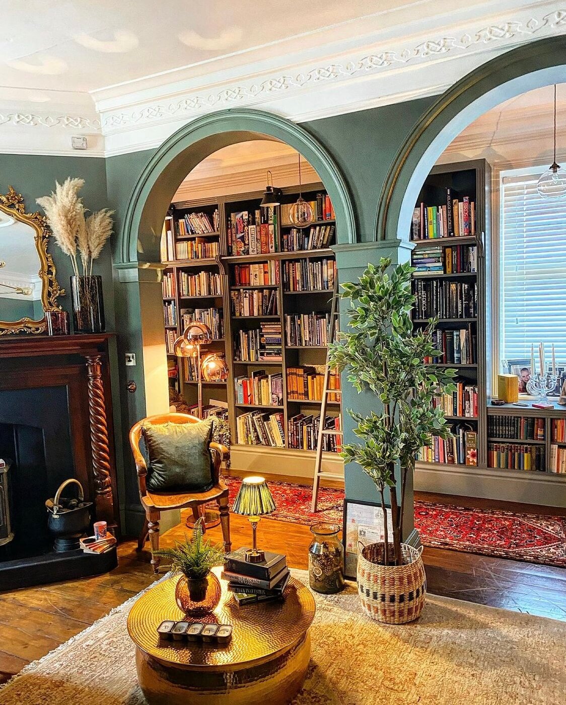 A Wonderful Eclectic Maximalist Home in England 5 sitting-room-fireplace-green-arches-home-library-nordroom