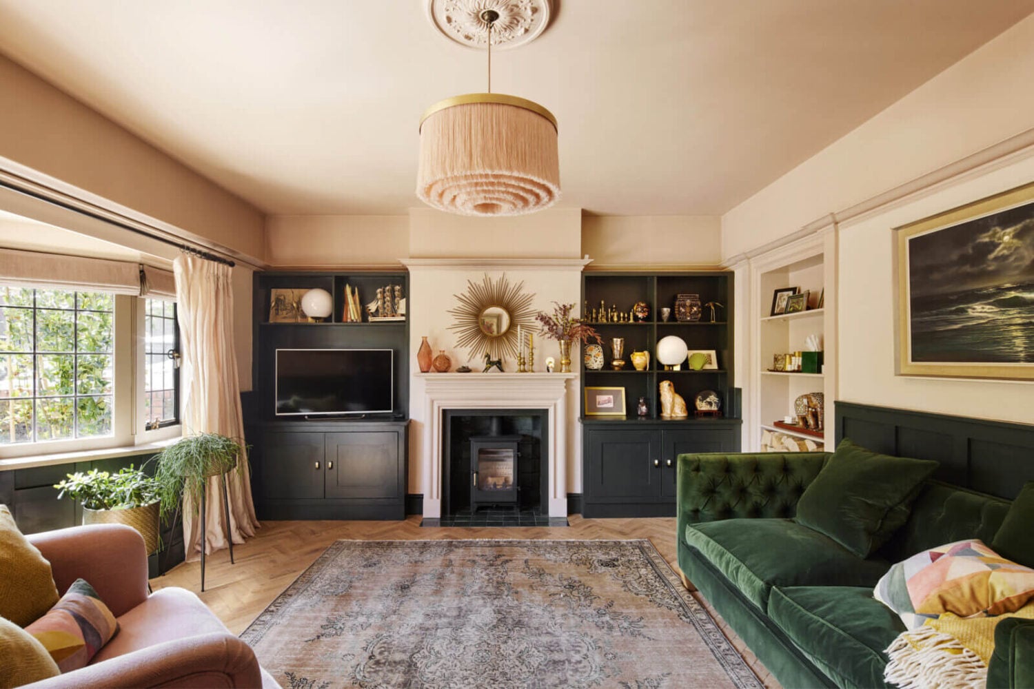 An Arts and Crafts House with Colorful Rooms 2 sitting-room-green-velvet-sofa-fireplace-bay-window-nordroom