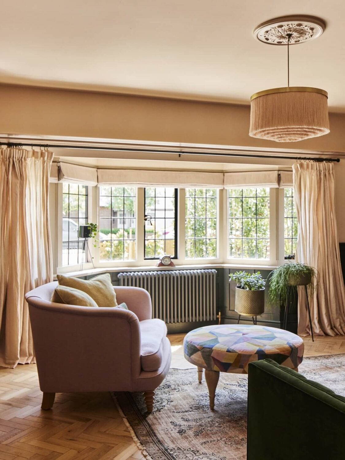 An Arts and Crafts House with Colorful Rooms 1 sitting-room-pink-armchair-bay-window-nordroom