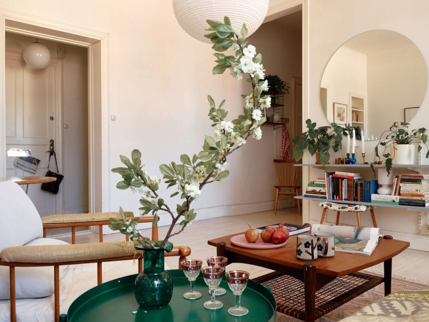 A Charming Apartment with Muted Blue Bedroom 8 sitting-room-round-mirror-nordroom