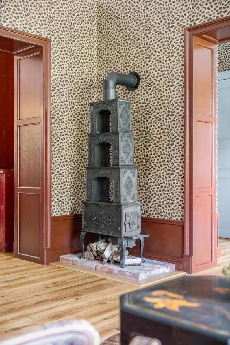 A Colorful Family Home in a Former School Building 17 sitting-room-woodburner-wallpaper-nordroom