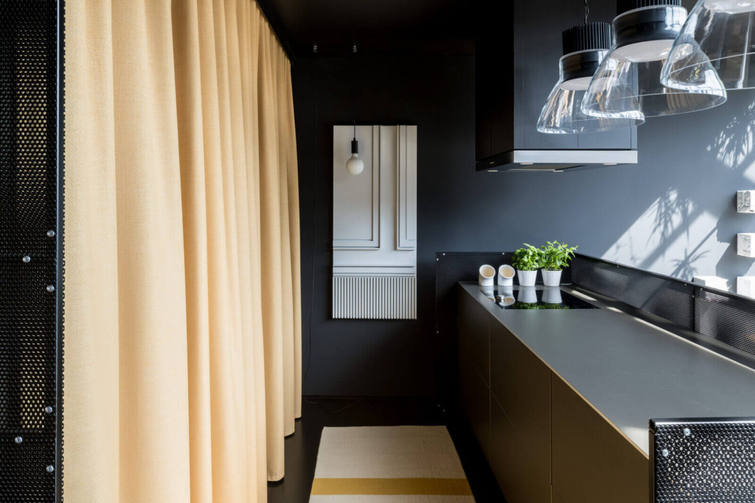 A Spectacular Modern Black Loft in London 7 sleek-modern-kitchen-soft-yellow-curtain-nordroom
