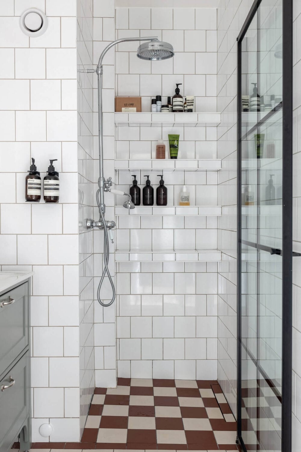 A Nordic Home with Blue Sitting Room and Kitchen 23 small-bathroom-built-in-shelves-industrial-shower-door-nordroom