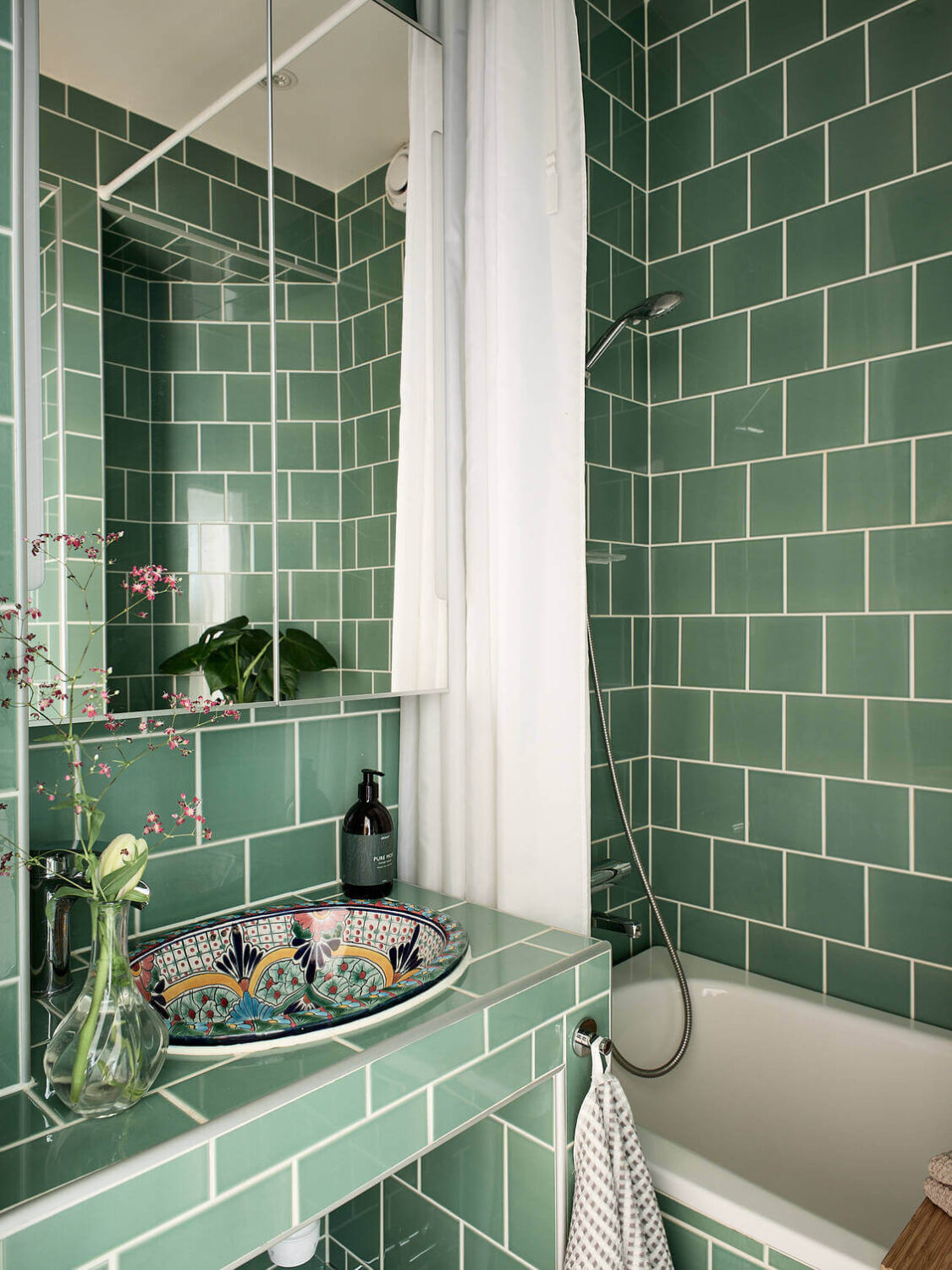 A Pink Studio Apartment with Green Bathroom 13 small-bathroom-green-tiles-colorful-sink-nordroom