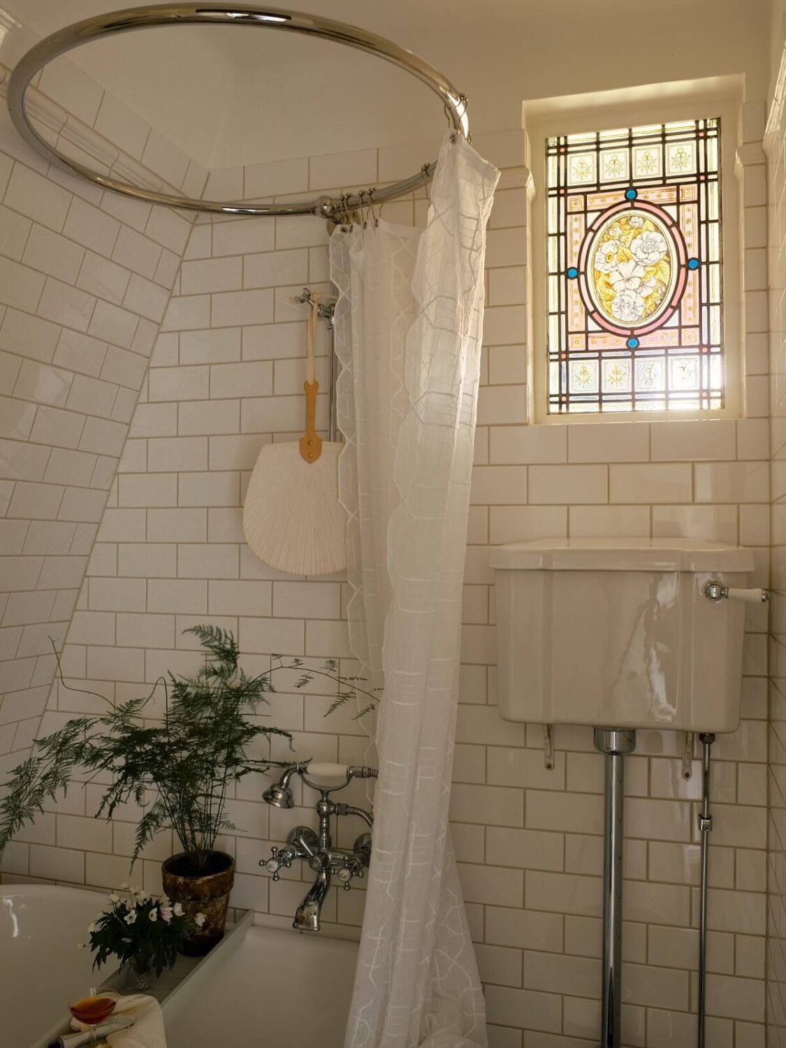 A Cozy Vintage Bohemian Maisonette in Sweden 25 small-bathroom-stained-glass-window-nordroom
