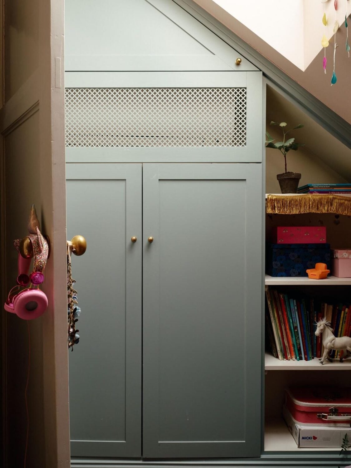 A Cozy Vintage Bohemian Maisonette in Sweden 29 small-kids-bedroom-slanted-ceiling-wardrobe-under-eaves-nordroom