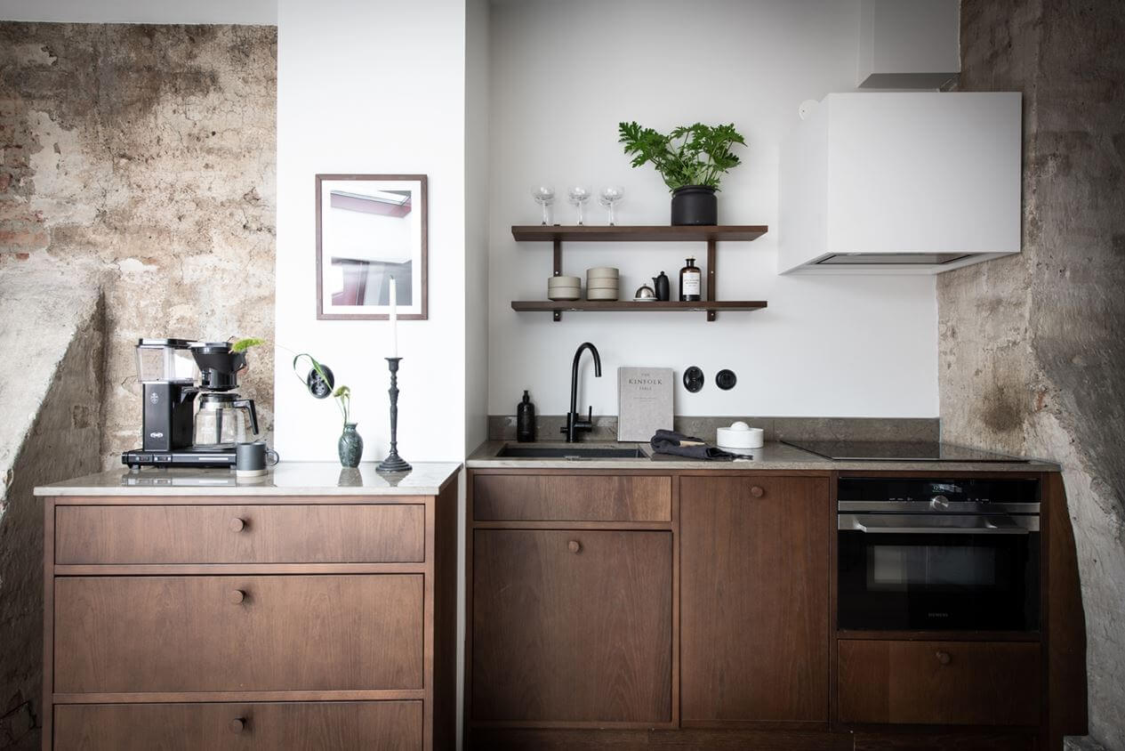 A Light Nordic Attic Loft with Raw Walls and Skylights 10 small-kitchen-walnut-cabinets-attic-apartment-sweden-nordroom