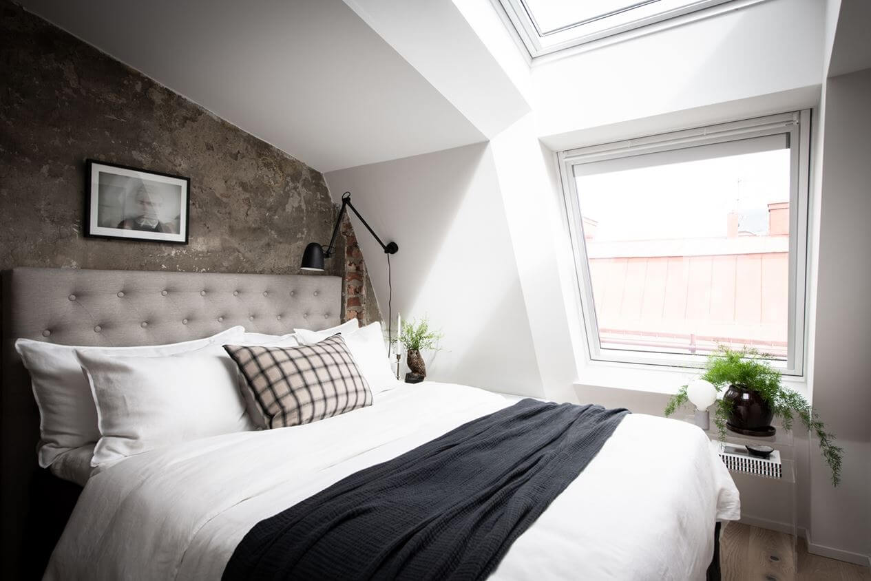 A Light Nordic Attic Loft with Raw Walls and Skylights 12 small-light-bedroom-skylight-attic-apartment-nordroom