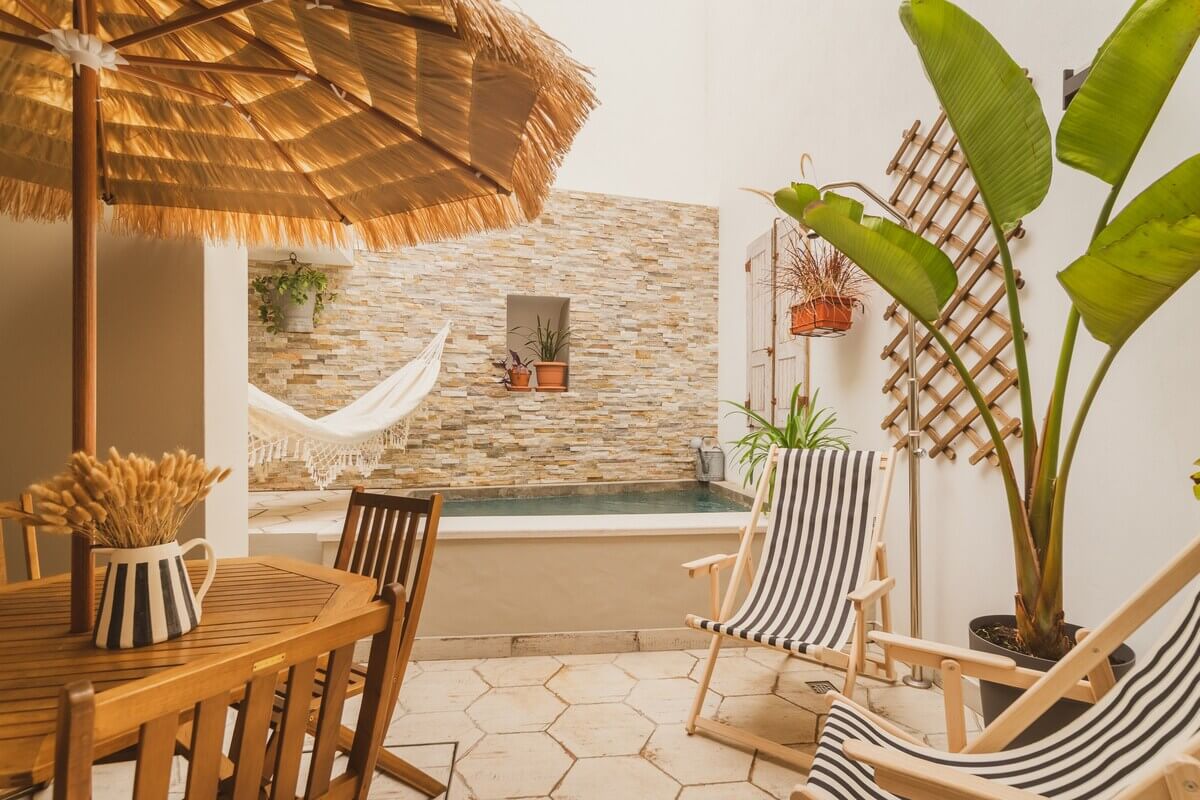A Serene Airbnb Home with Patio in Lagos, Portugal 13 small-patio-swimming-pool-sun-bathing-dining-space-nordroom
