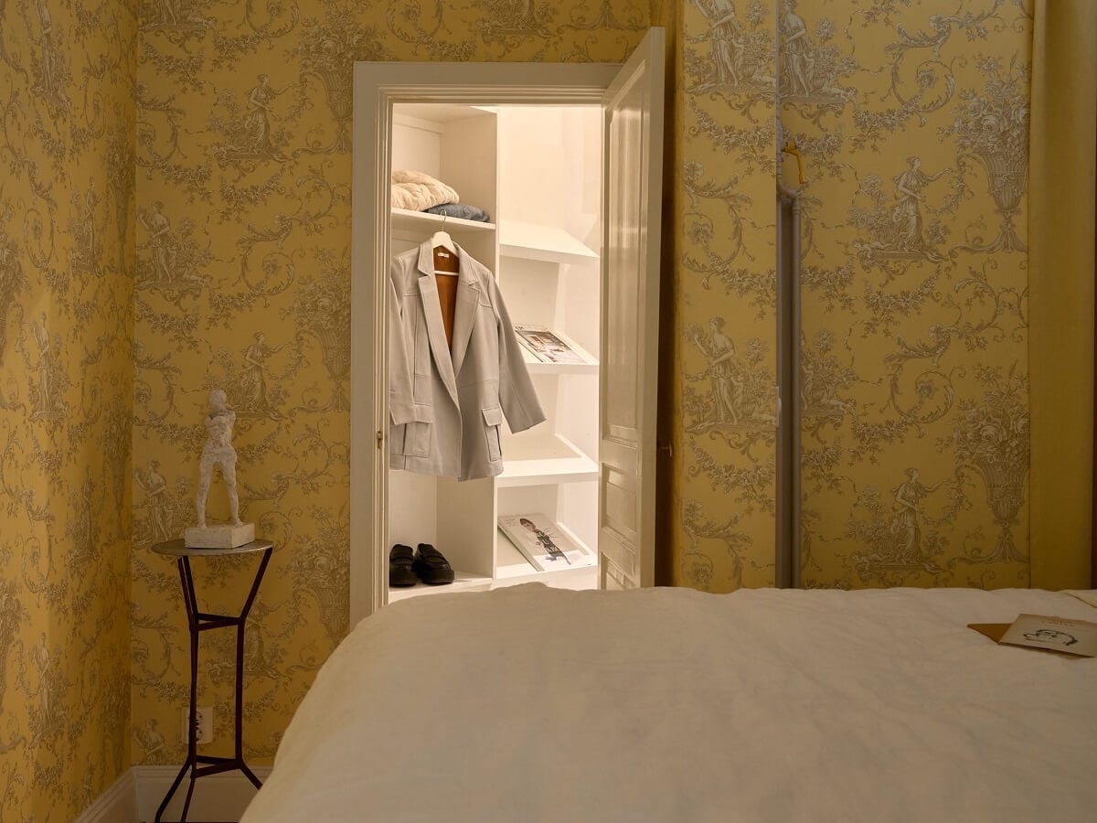 A Bedroom with Yellow French Wallpaper in a Small Scandi Home 14 small-yellow-bedroom-wallpaper-walk-in-closet-nordroom