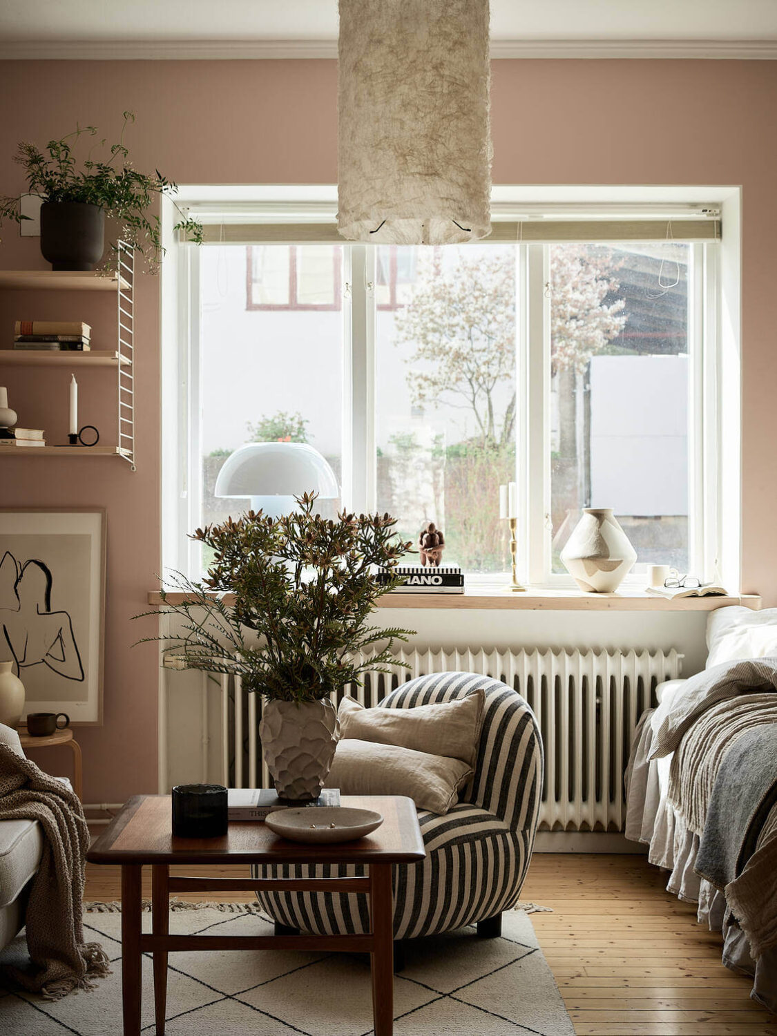 A Pink Studio Apartment with Green Bathroom 2 striped-chair-pink-studio-apartment-scandinavian-decor-nordroom