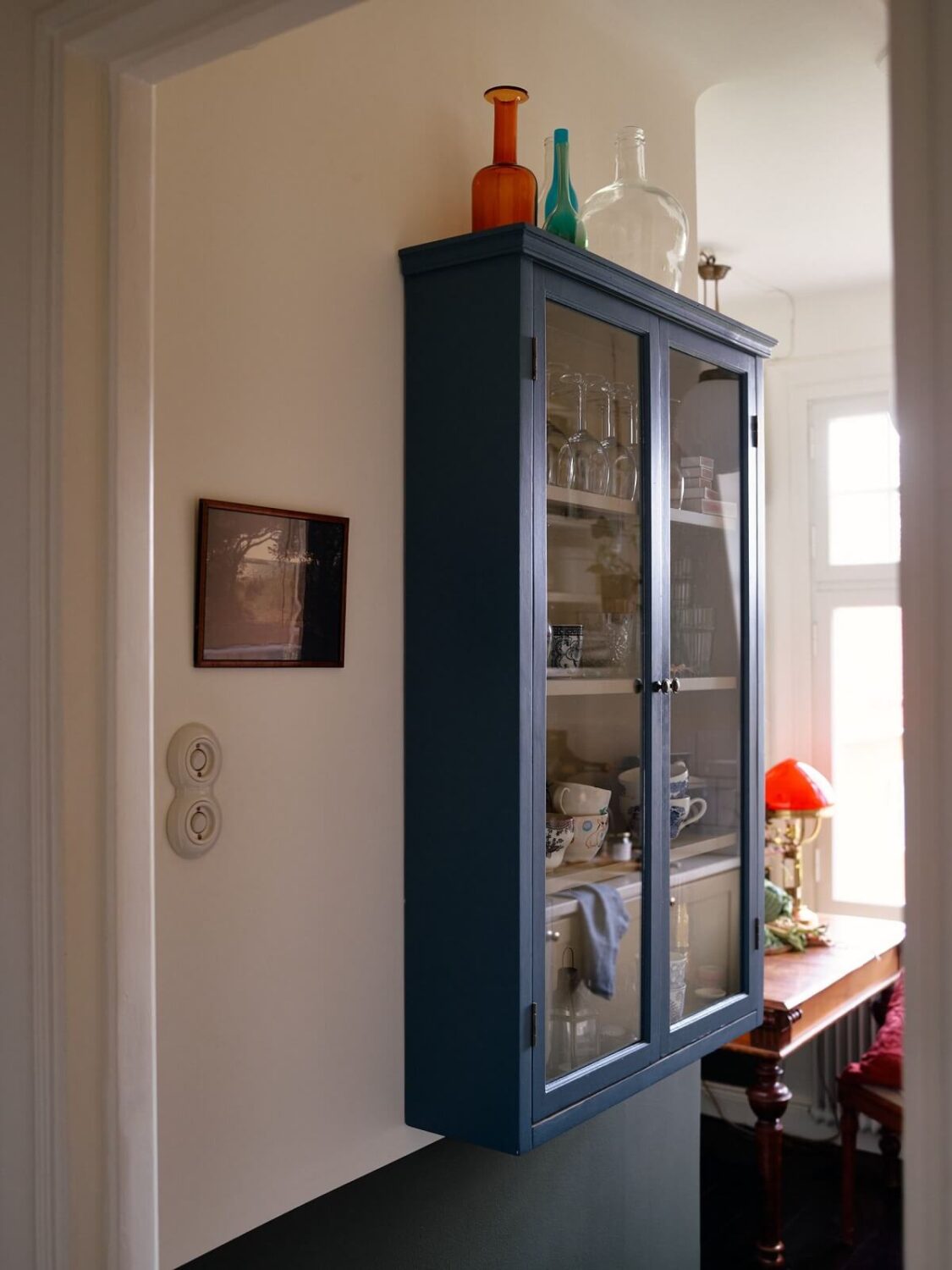 A Cozy Vintage Bohemian Maisonette in Sweden 16 wall-mounted-blue-glass-cabinets-kitchen-nordroom