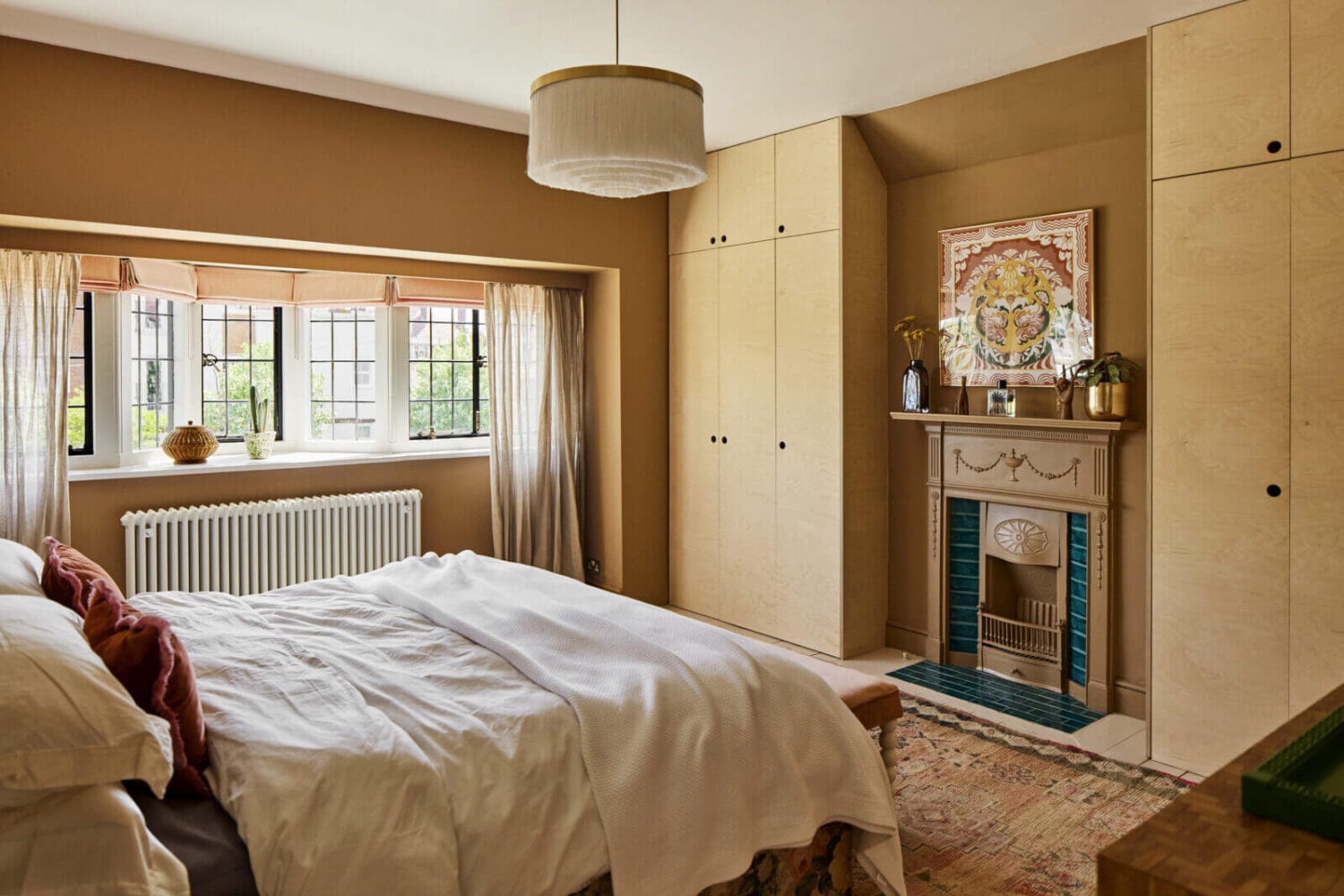 An Arts and Crafts House with Colorful Rooms 20 warm-bedroom-fireplace-built-in-wardrobes-nordroom