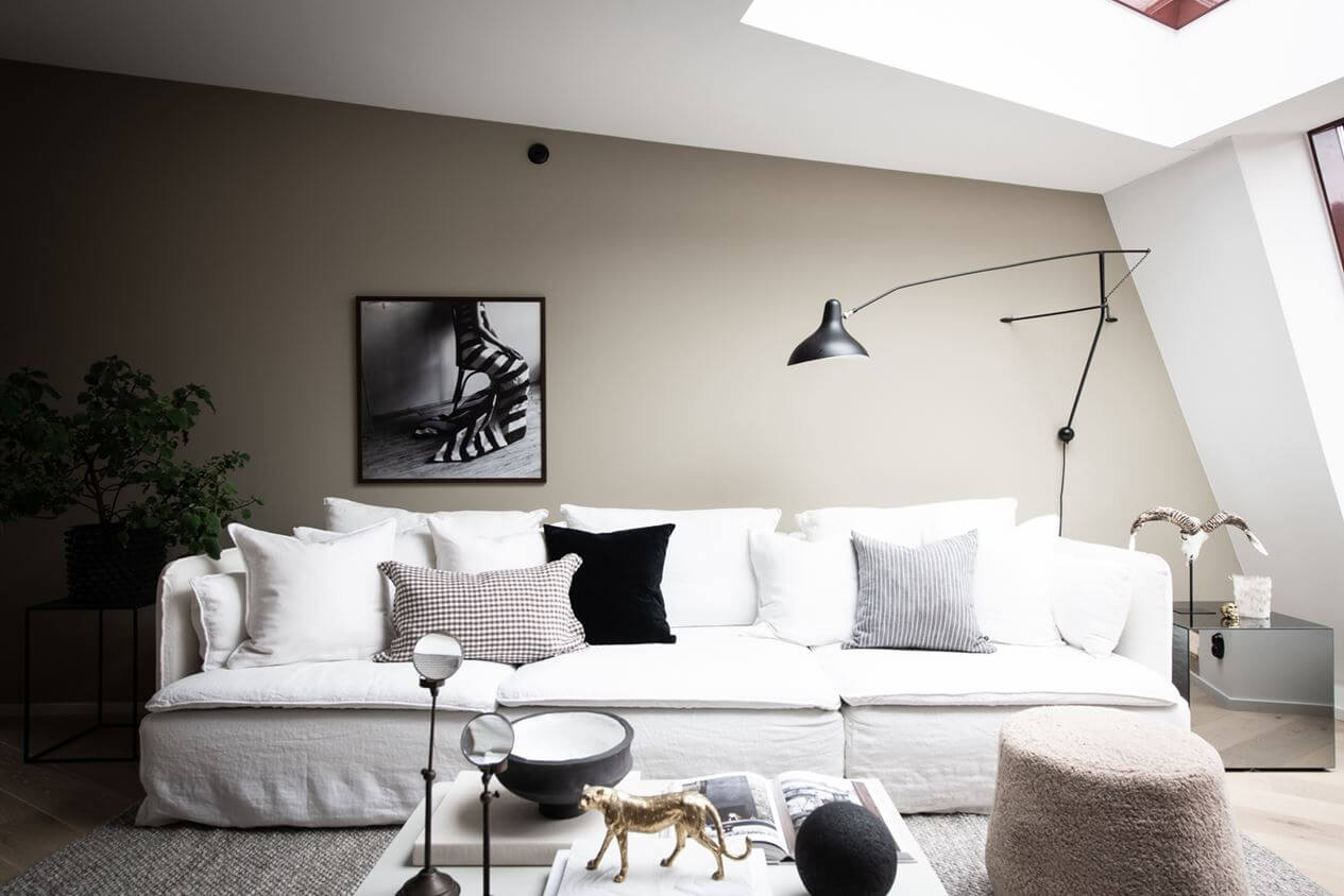A Light Nordic Attic Loft with Raw Walls and Skylights 4 white-nordic-sofa-attic-apartment-skylight-nordroom