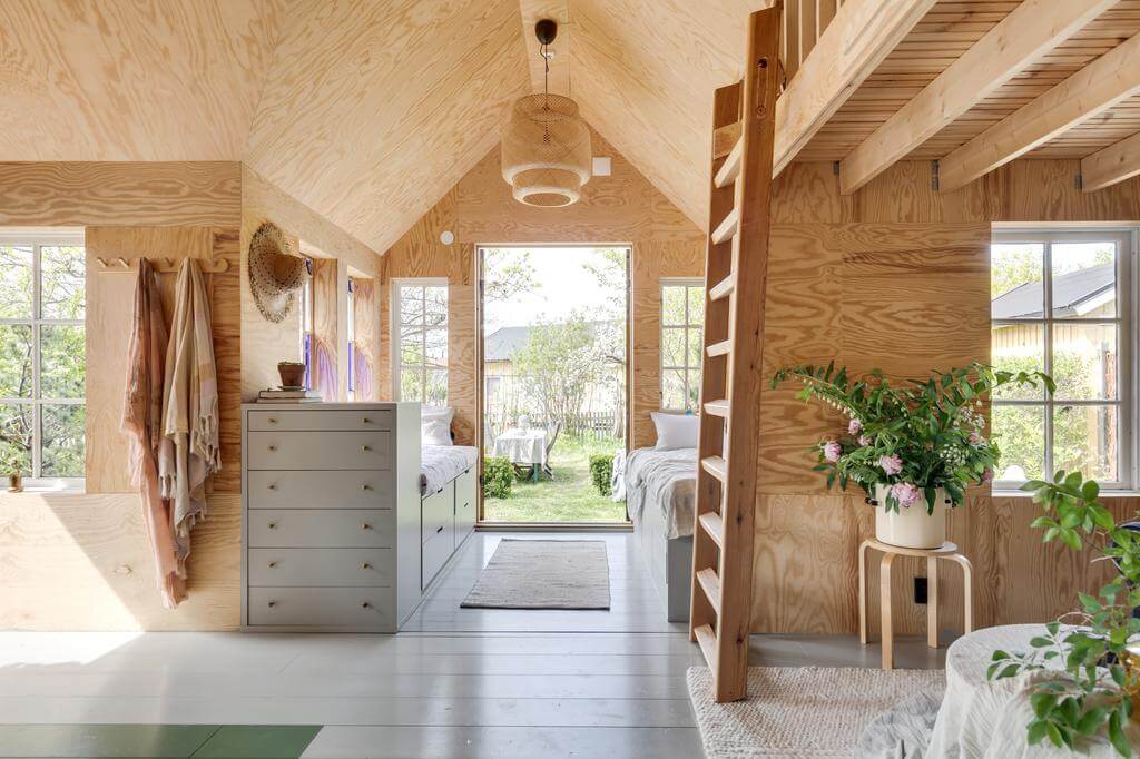 A Red Wooden Cottage on a Swedish Allotment 4 wooden cottage loft bed wooden floor nordroom A Red Wooden Cottage on a Swedish Allotment