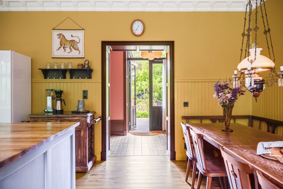 A Colorful Family Home in a Former School Building 15 yellow-walls-kitchen-dining-table-nordroom