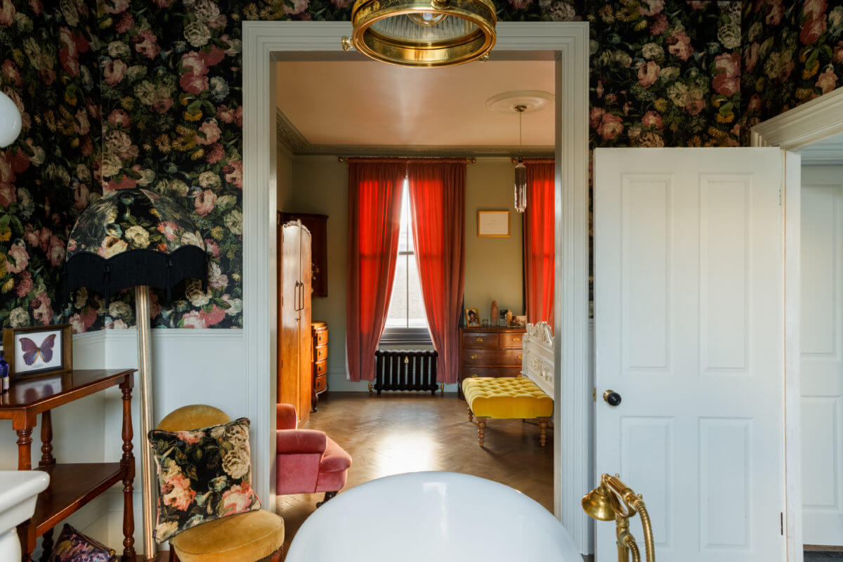 A Georgian Home with Floral Vintage-Style Bathroom 18 bath-view-master-en-suite-floral-wallpaper-nordroom