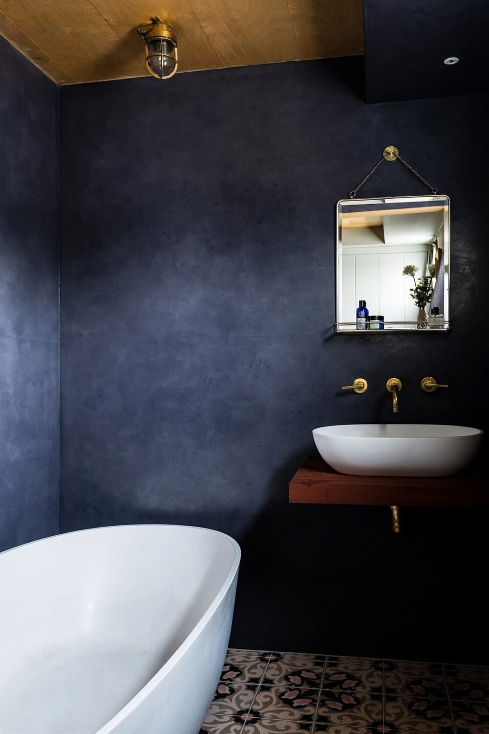 A Houseboat in London Fit For A Family 12 bathroom-dark-blue-walls-freestanding-bath-nordroom