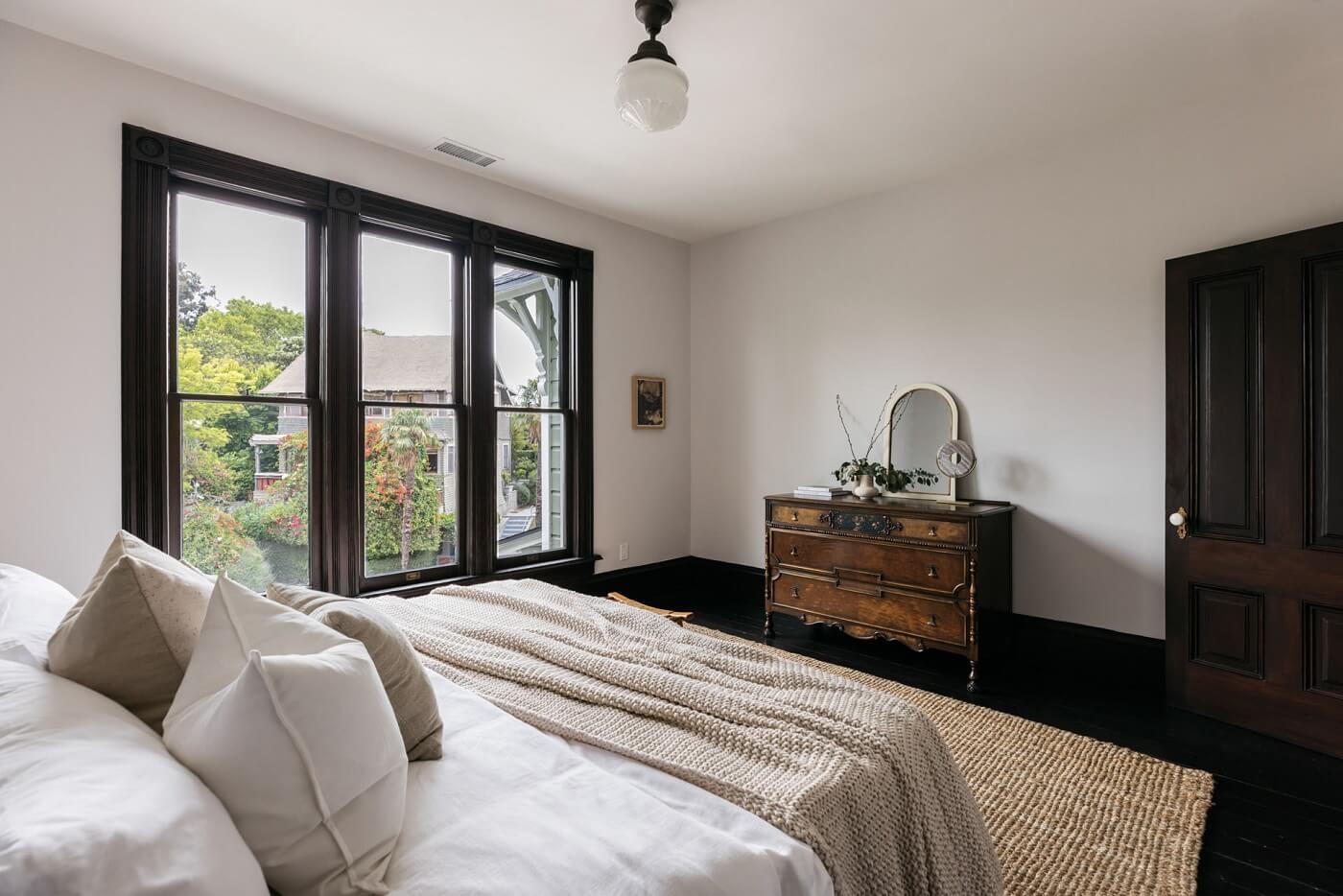 A Carefully Restored Victorian House in Los Angeles 19 bedroom-dark-wooden-floor-vintage-dresser-nordroom