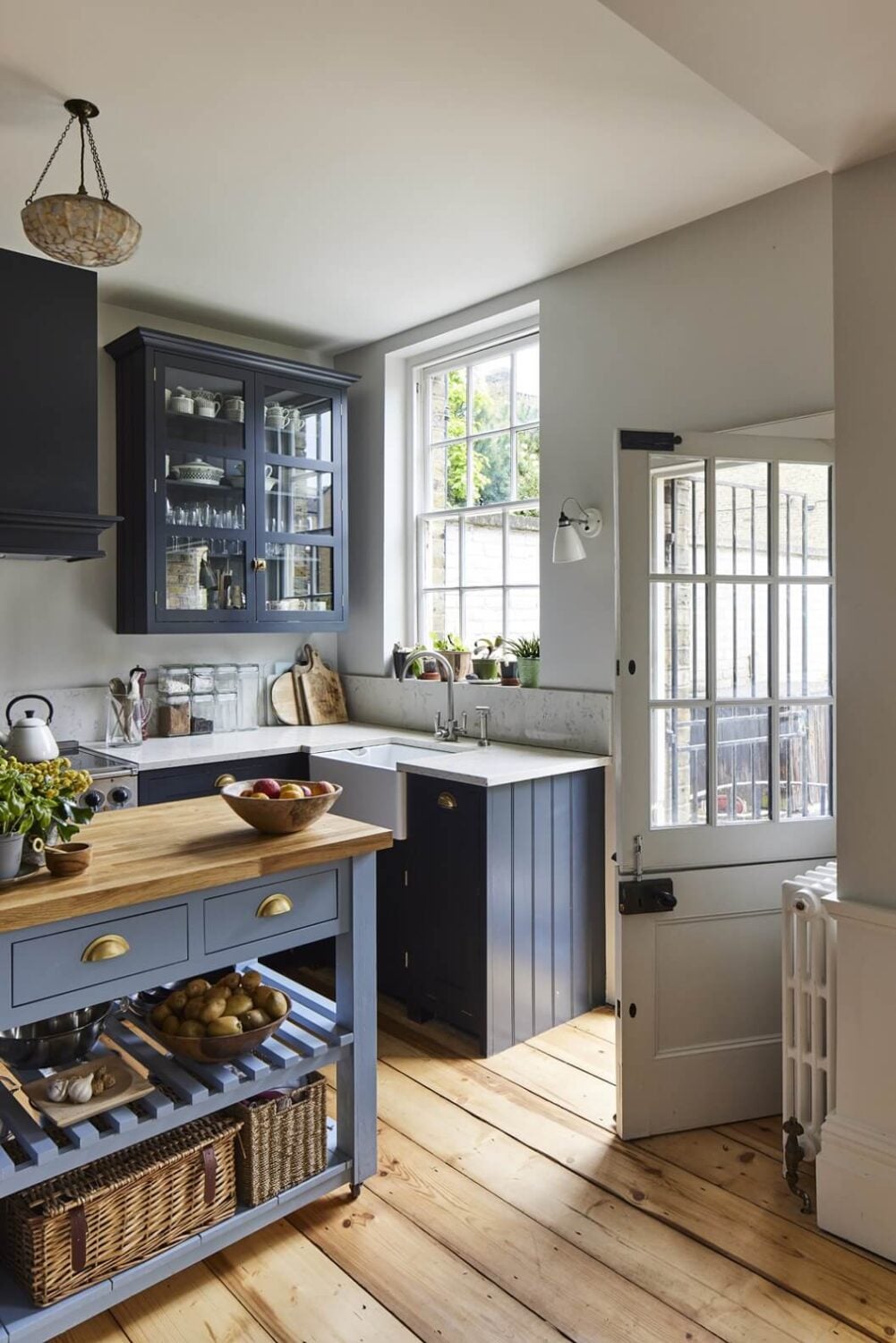 31 Practical Kitchen Flooring Ideas For Your Home 25 blue-kitchen-cabinets-wooden-floor-nordroom