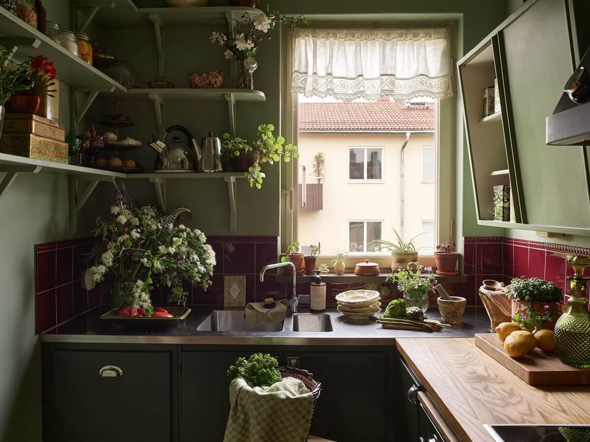 Midcentury Furniture in a Pink and Green Home 2 burgundy-tiles-green-kitchen-shelves