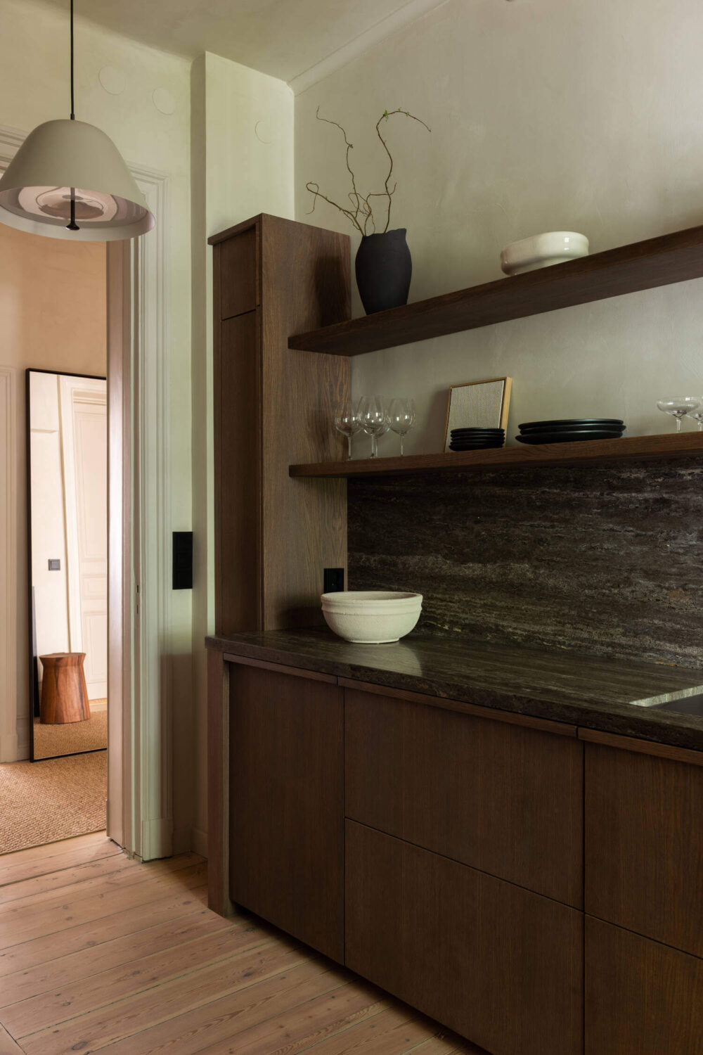 Japandi Interior Design in a Small Nordic Home 14 dark-wooden-nordic-kitchen-black-worktop-open-shelves-nordroom