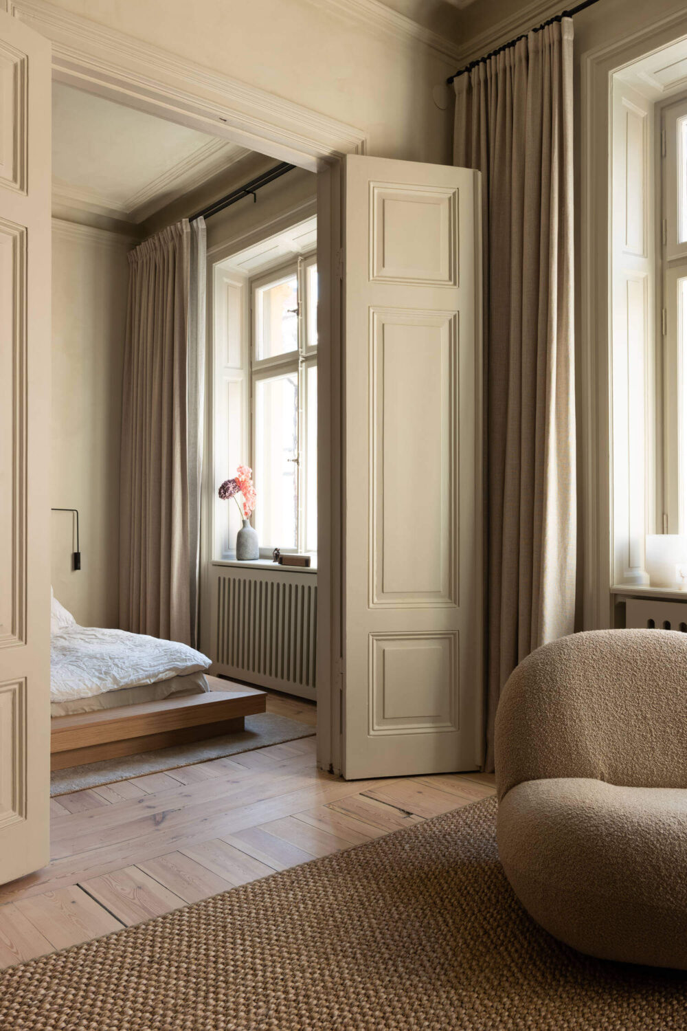 Japandi Interior Design in a Small Nordic Home 6 double-doors-bedroom-wooden-floor-nordroom