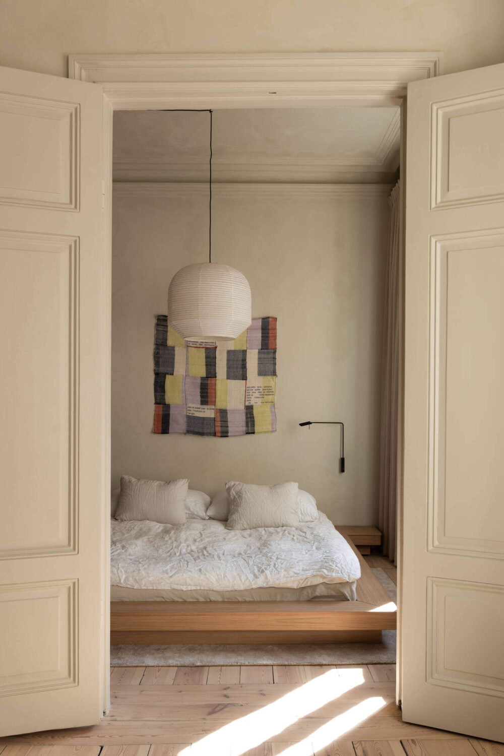 Japandi Interior Design in a Small Nordic Home 7 double-wooden-doors-bedroom-japandi-nordroom