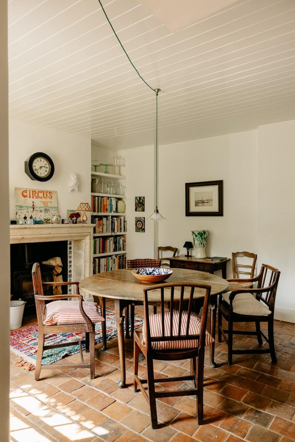 A Carefully Restored Victorian House in London 7 farmhouse-style-dining-room-terracotta-tiles-round-table-fireplace-nordroom