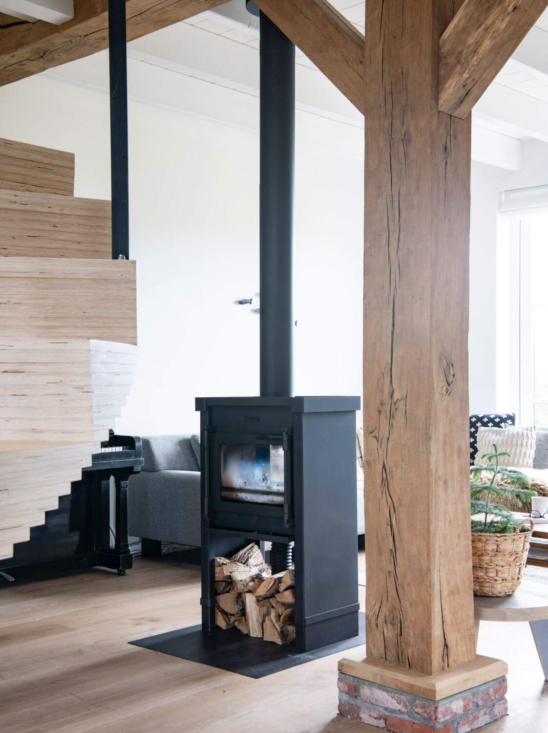 A Dutch Country Home with a Tiny House in the Garden 8 fireplace-exposed-beams-sitting-room-nordroom