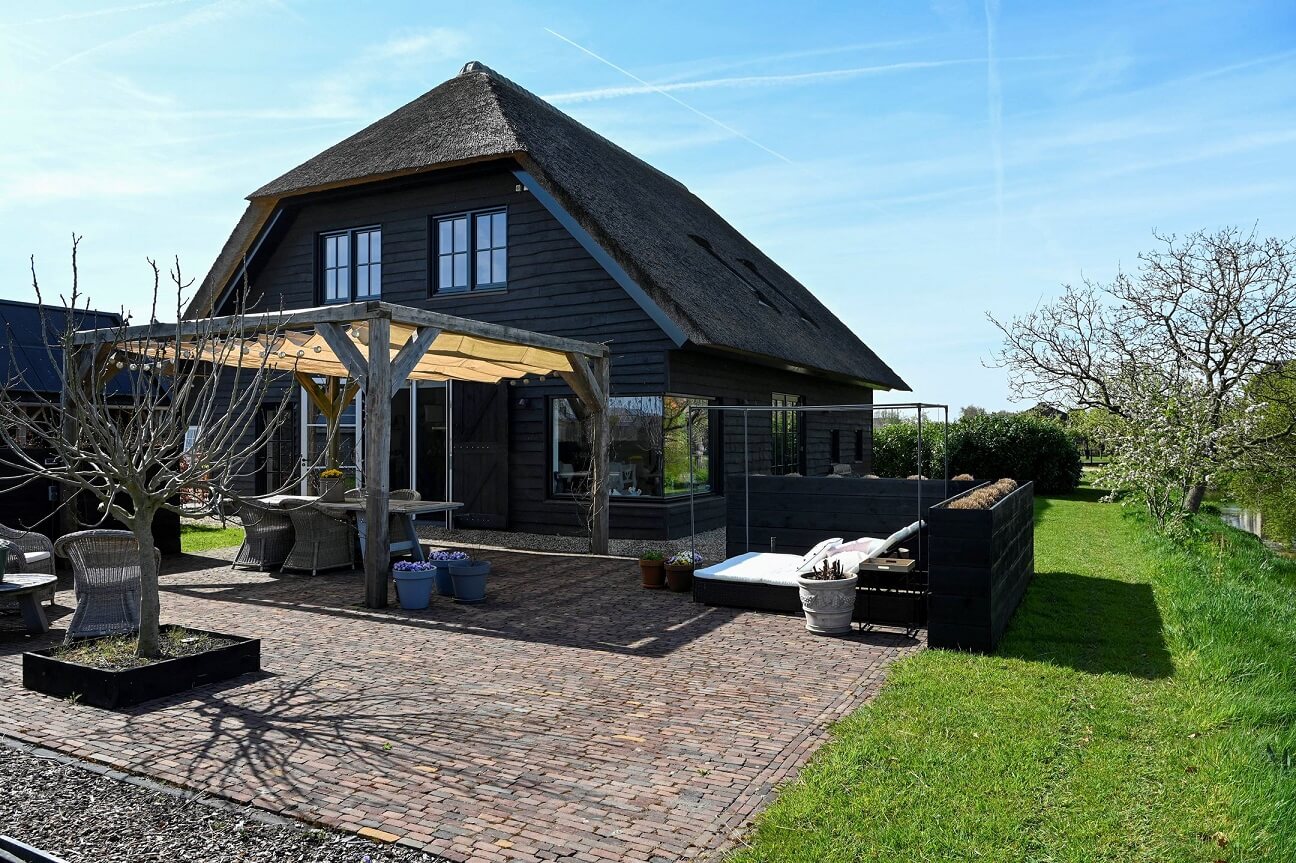A Dutch Country Home with a Tiny House in the Garden 20 garden-seating-exterior-dutch-countryhouse