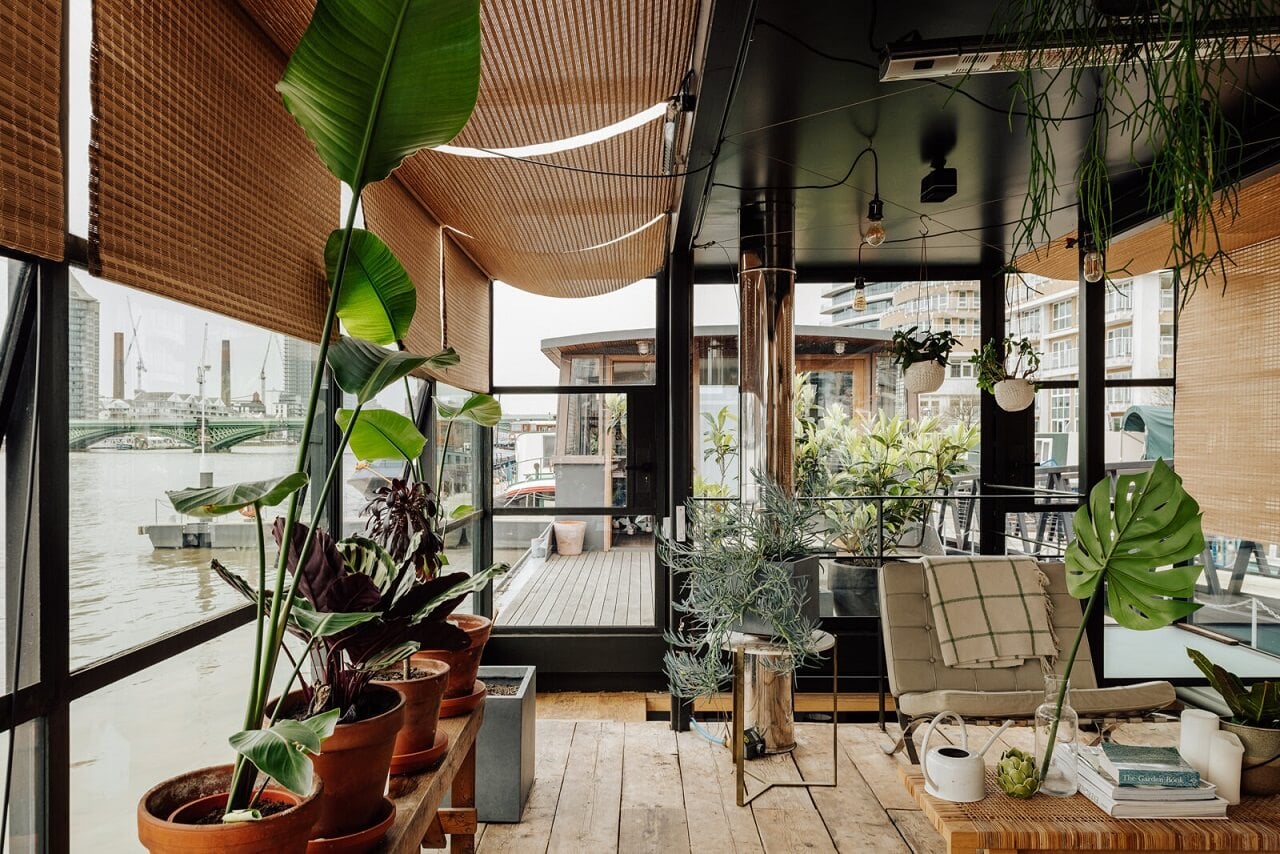A Houseboat in London Fit For A Family 3 glass-sitting-room-plants-houseboat-london-nordroom